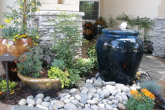 Blue fountain and other pots