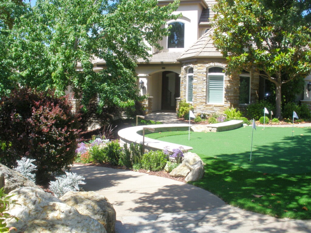 Retaining wall putting green and house